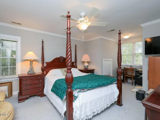 a bedroom with bed and window