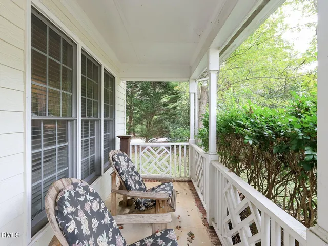 a view of balcony with furniture