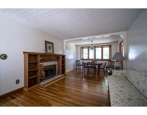 75 Hilldale Road Ashland, MA 01721 - Photo 13 of 37 a living room with furniture and a fireplace
