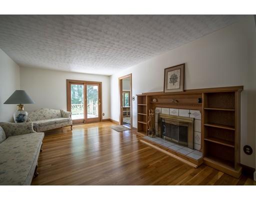 75 Hilldale Road Ashland, MA 01721 - Photo 14 of 37 a living room with furniture and a fireplace
