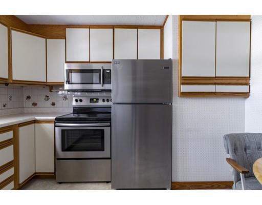 75 Hilldale Road Ashland, MA 01721 - Photo 18 of 37 a kitchen with stainless steel appliances a refrigerator sink and cabinets