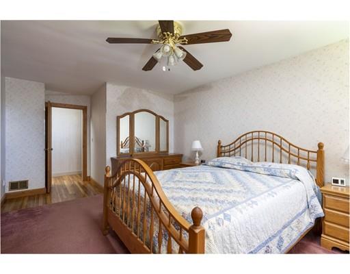 75 Hilldale Road Ashland, MA 01721 - Photo 21 of 37 a bedroom with a bed and a dresser with wooden floor