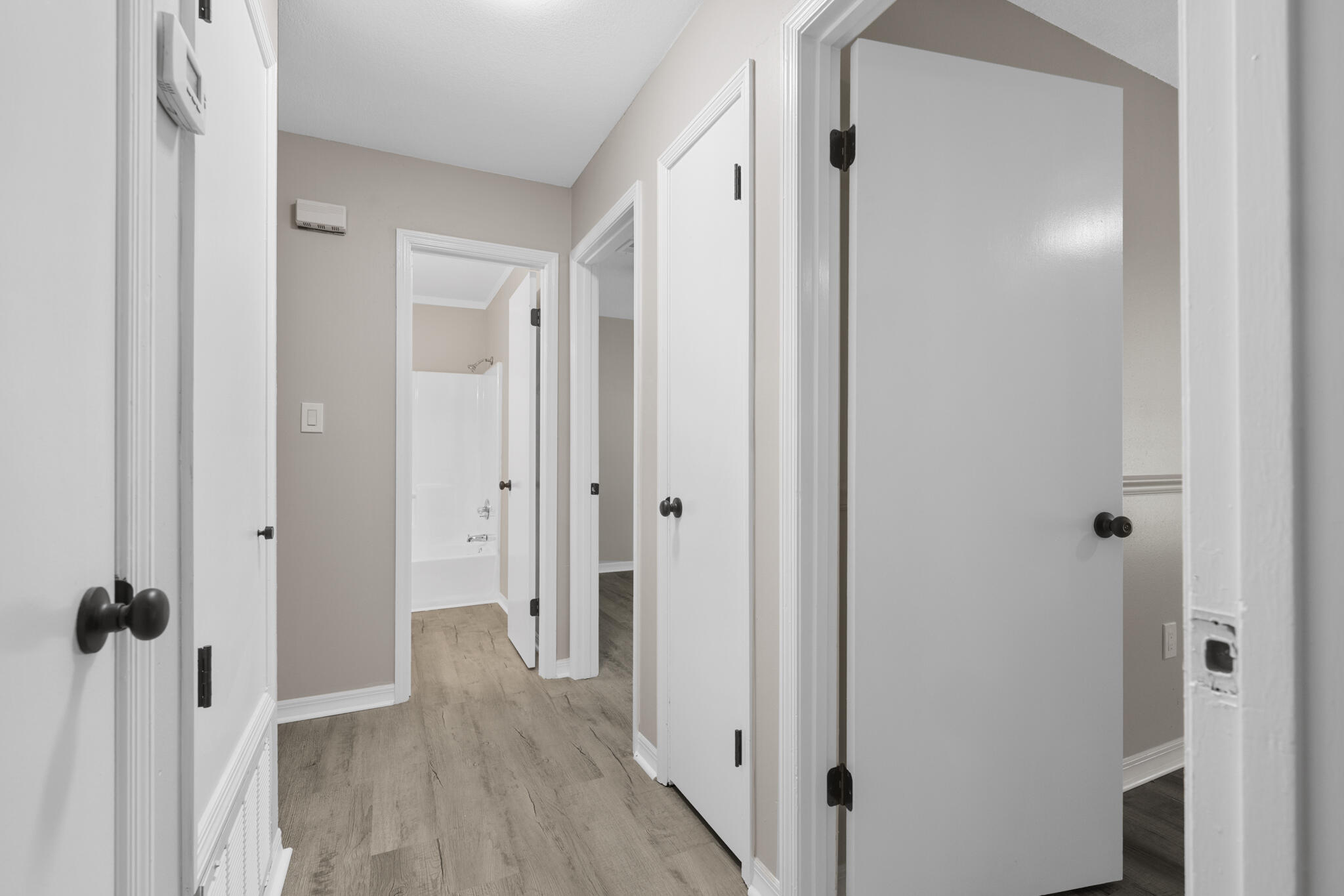 3437 Auburn Road Crestview, FL 32539 - Photo 12 of 26 a view of a hallway with wooden floor