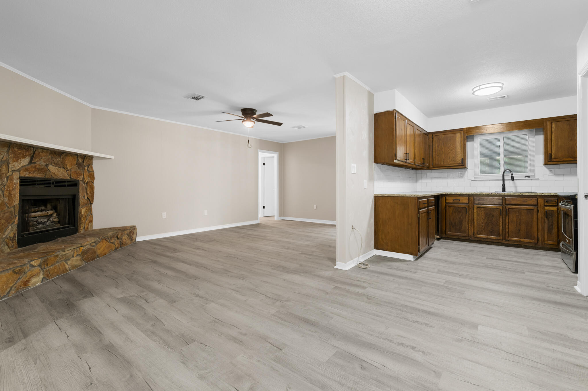3437 Auburn Road Crestview, FL 32539 - Photo 18 of 26 a view of kitchen with stainless steel appliances granite countertop a sink and cabinets
