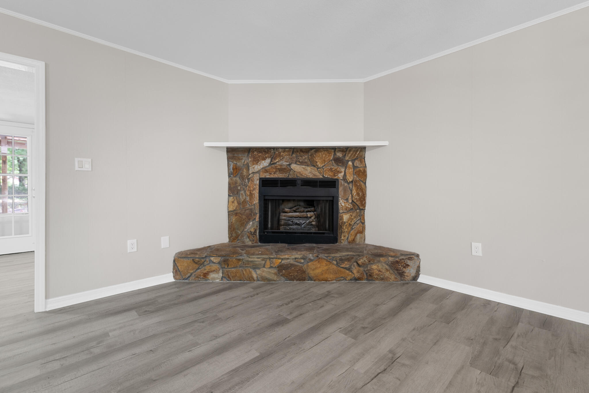 3437 Auburn Road Crestview, FL 32539 - Photo 21 of 26 a living room with a fireplace