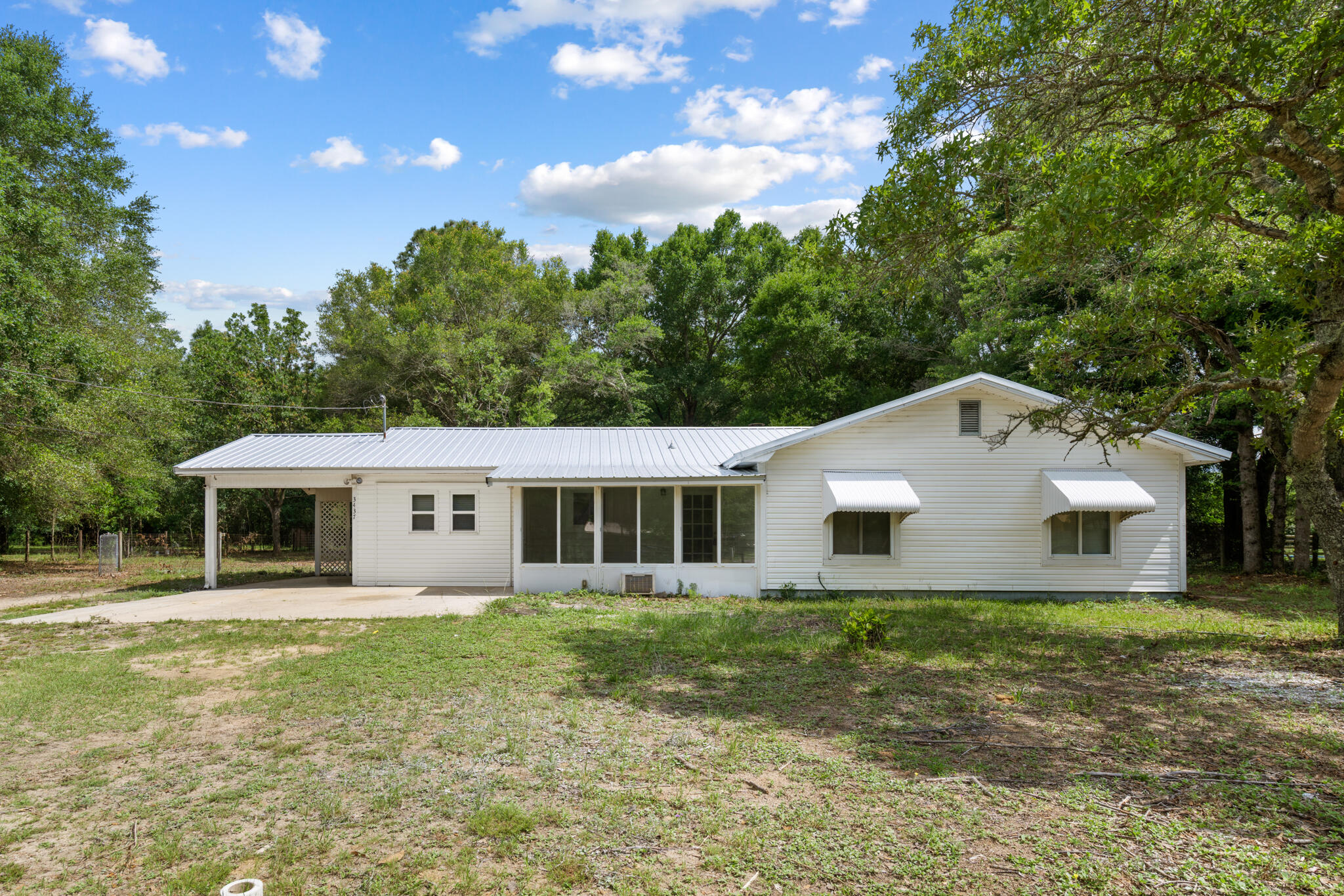 3437 Auburn Road Crestview, FL 32539 - Photo 25 of 26 a view of a house with a backyard