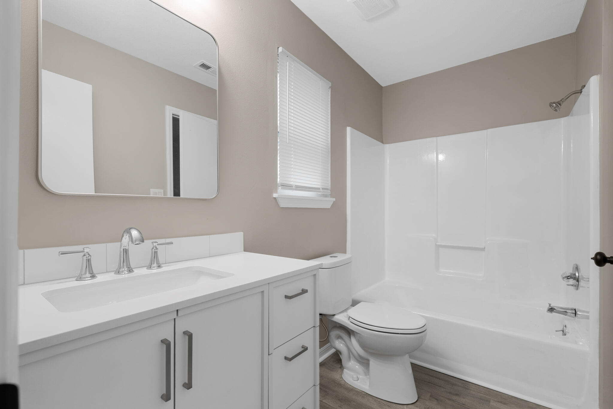 3437 Auburn Road Crestview, FL 32539 - Photo 6 of 26 a bathroom with a sink a toilet and shower