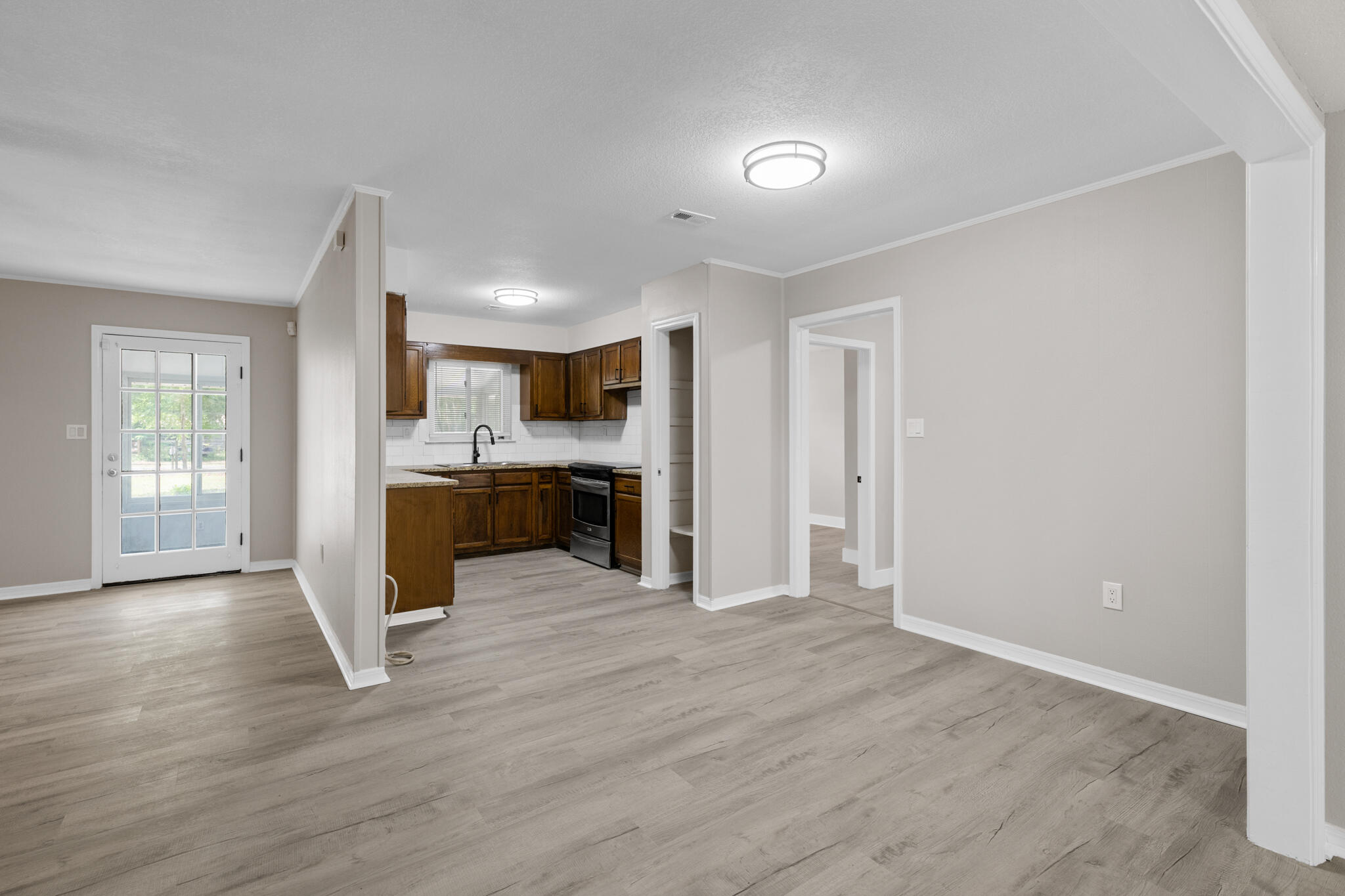 3437 Auburn Road Crestview, FL 32539 - Photo 10 of 26 a view of kitchen with wooden floor