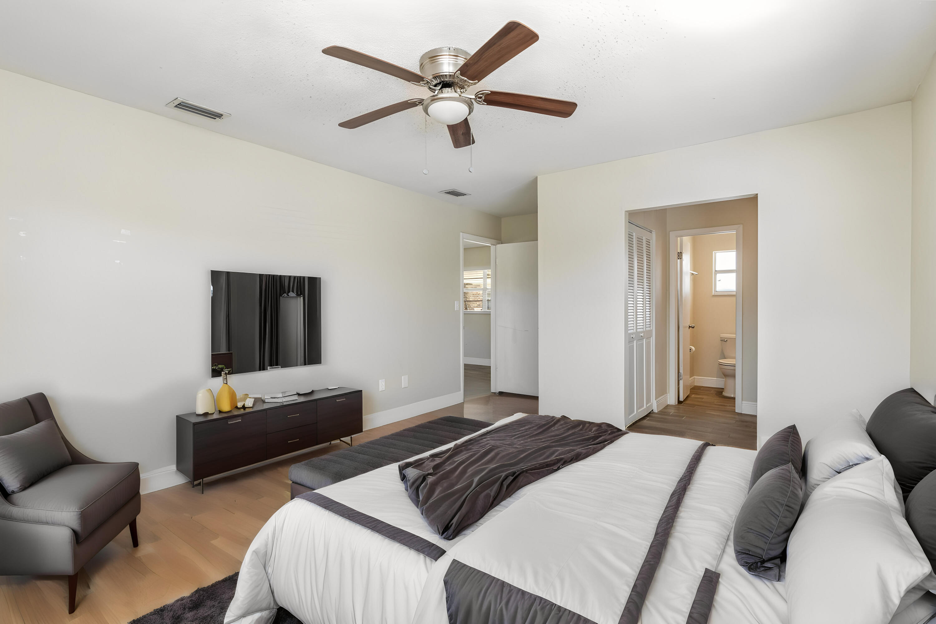 1294 Cimarron Circle Northeast Palm Bay, FL 32905 - Photo 22 of 45 a bedroom with bed and a couch