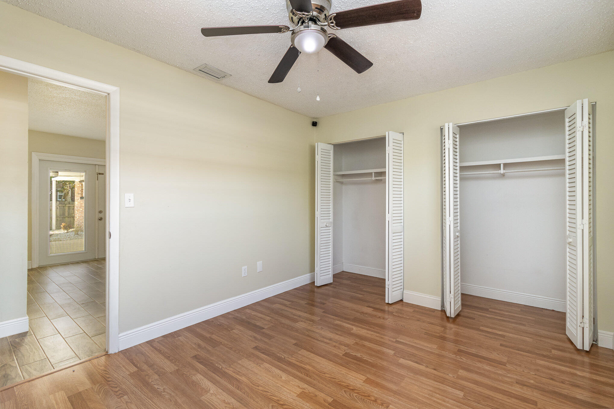 1294 Cimarron Circle Northeast Palm Bay, FL 32905 - Photo 27 of 45 a view of empty room with wooden floor