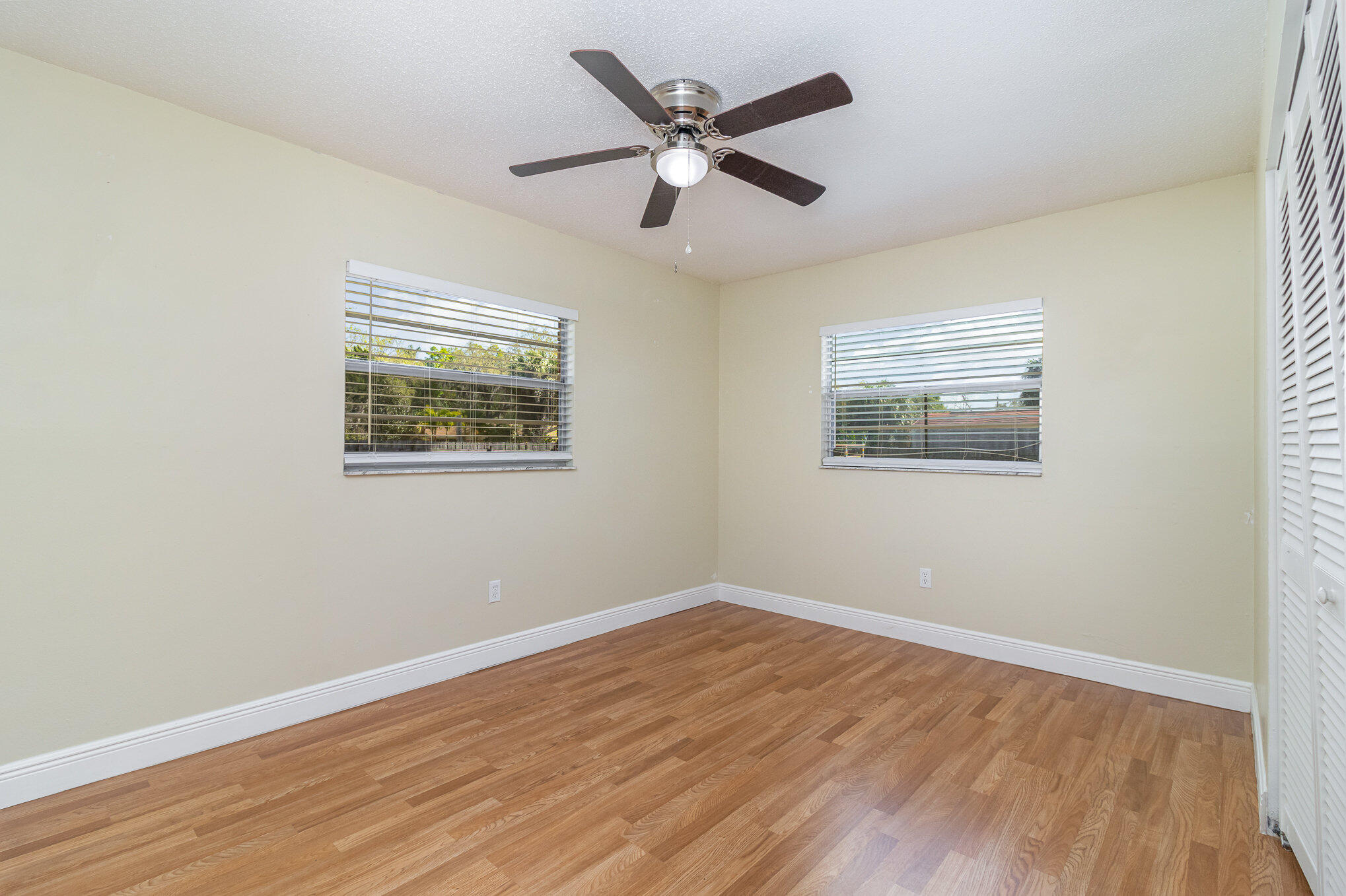 1294 Cimarron Circle Northeast Palm Bay, FL 32905 - Photo 35 of 45 a view of empty room with wooden floor