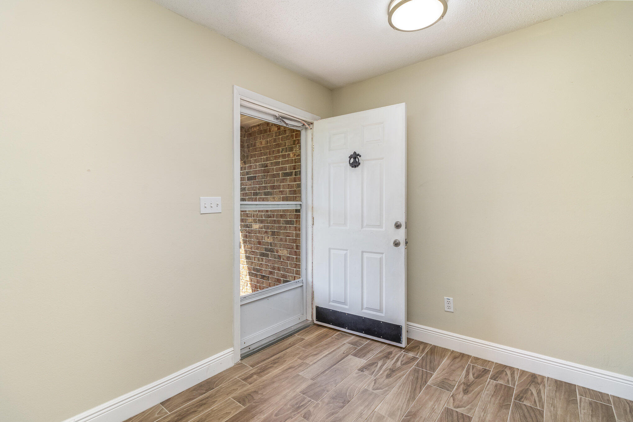 1294 Cimarron Circle Northeast Palm Bay, FL 32905 - Photo 36 of 45 an empty room with windows