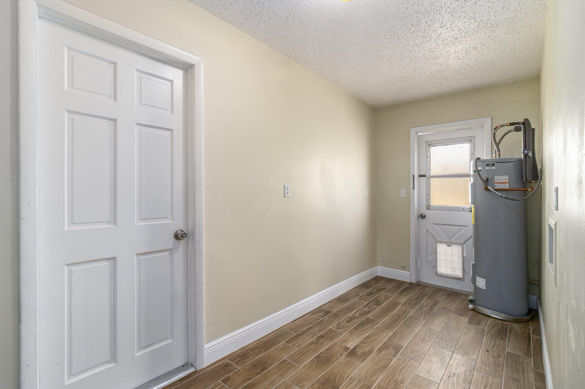 1294 Cimarron Circle Northeast Palm Bay, FL 32905 - Photo 37 of 45 a view of empty room with wooden floor and fan