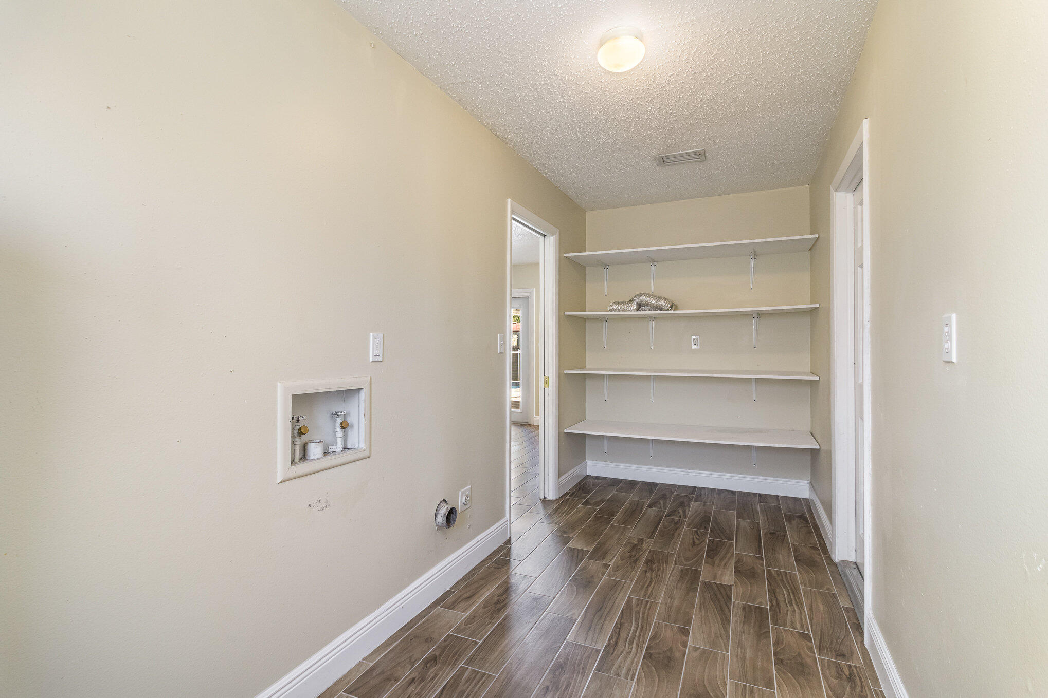 1294 Cimarron Circle Northeast Palm Bay, FL 32905 - Photo 38 of 45 a view of a room with a wooden floor