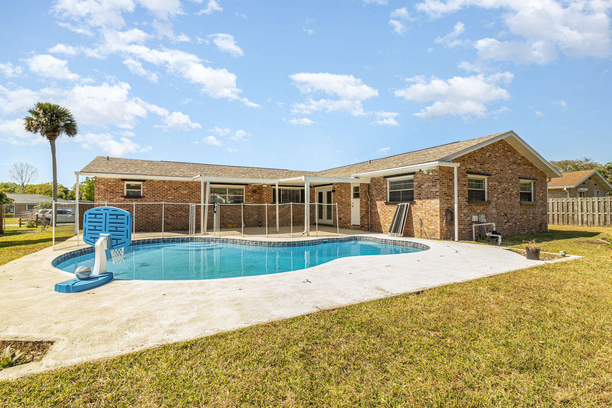 1294 Cimarron Circle Northeast Palm Bay, FL 32905 - Photo 42 of 45 a front view of a house with a garden