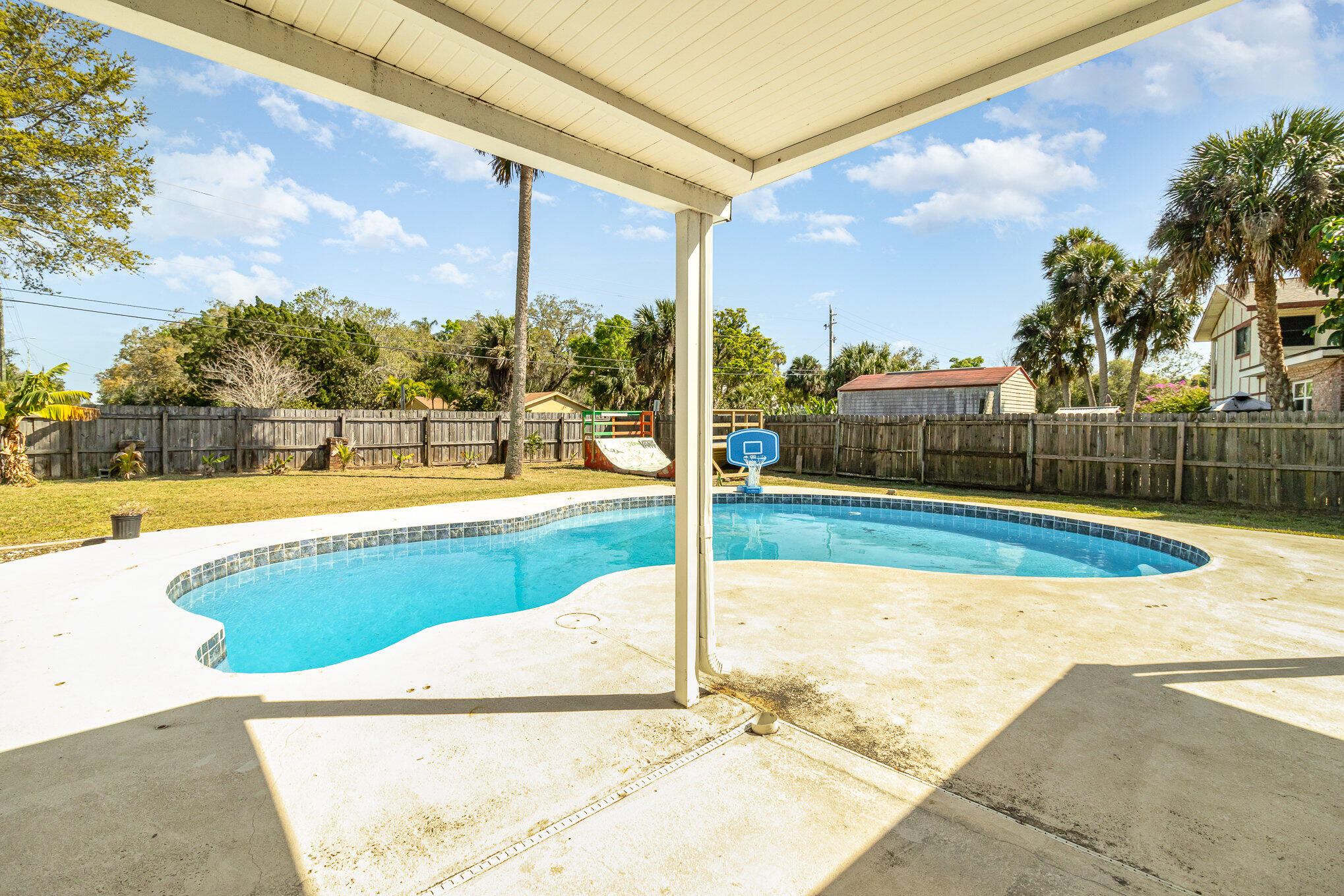 1294 Cimarron Circle Northeast Palm Bay, FL 32905 - Photo 43 of 45 a view of a swimming pool