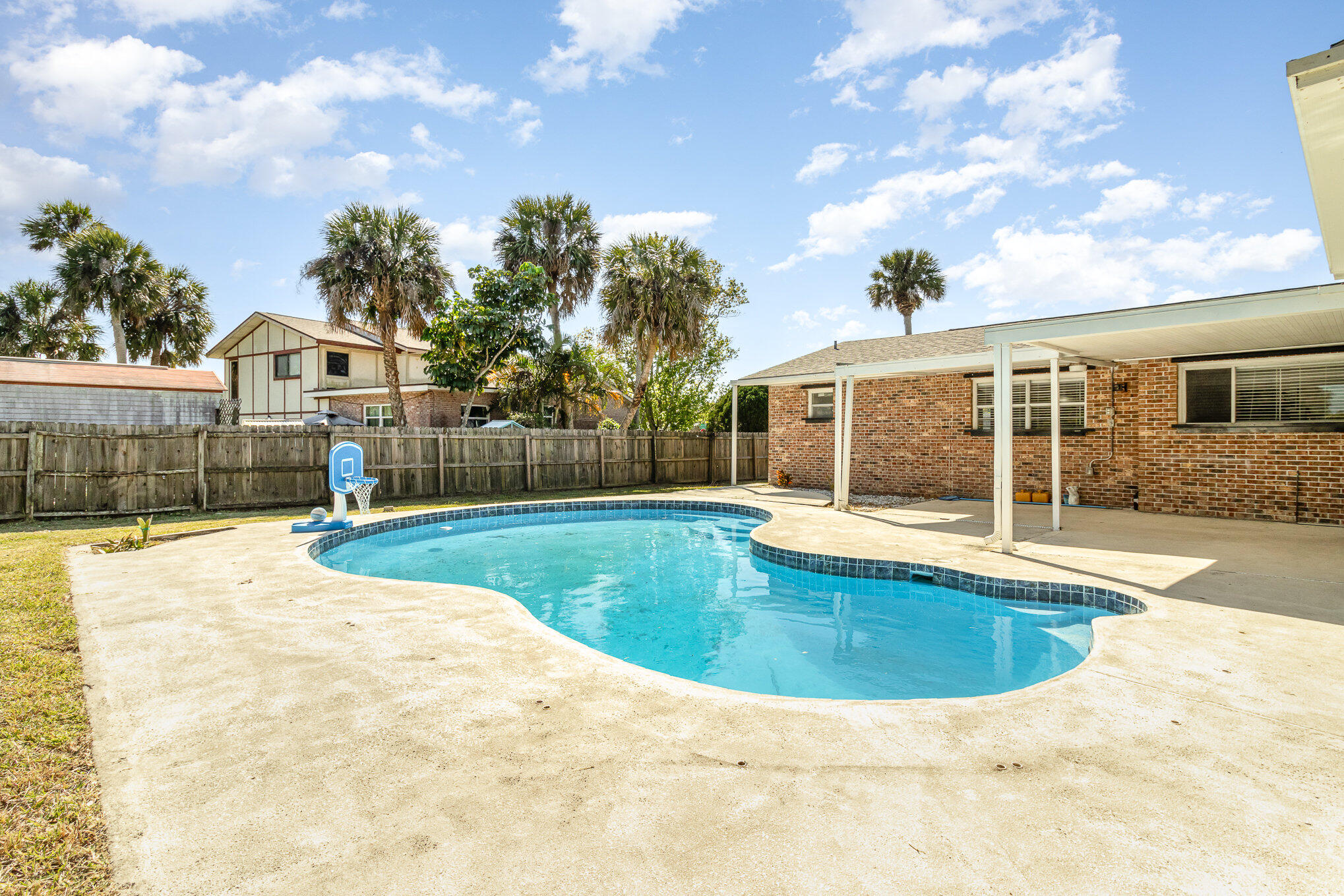 1294 Cimarron Circle Northeast Palm Bay, FL 32905 - Photo 44 of 45 a view of a house with swimming pool and sitting area