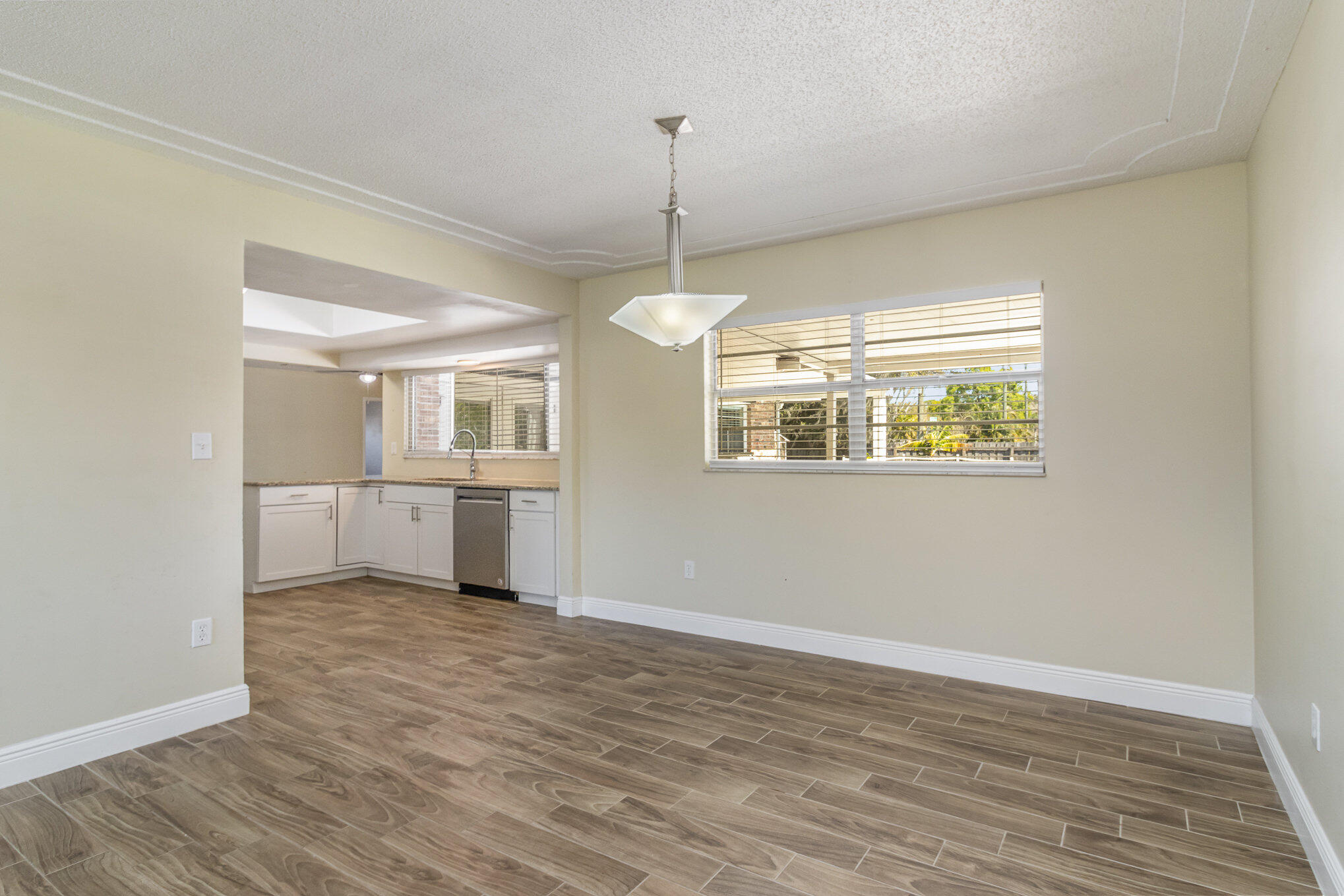 1294 Cimarron Circle Northeast Palm Bay, FL 32905 - Photo 7 of 45 a view of a kitchen and a dishwasher cabinets