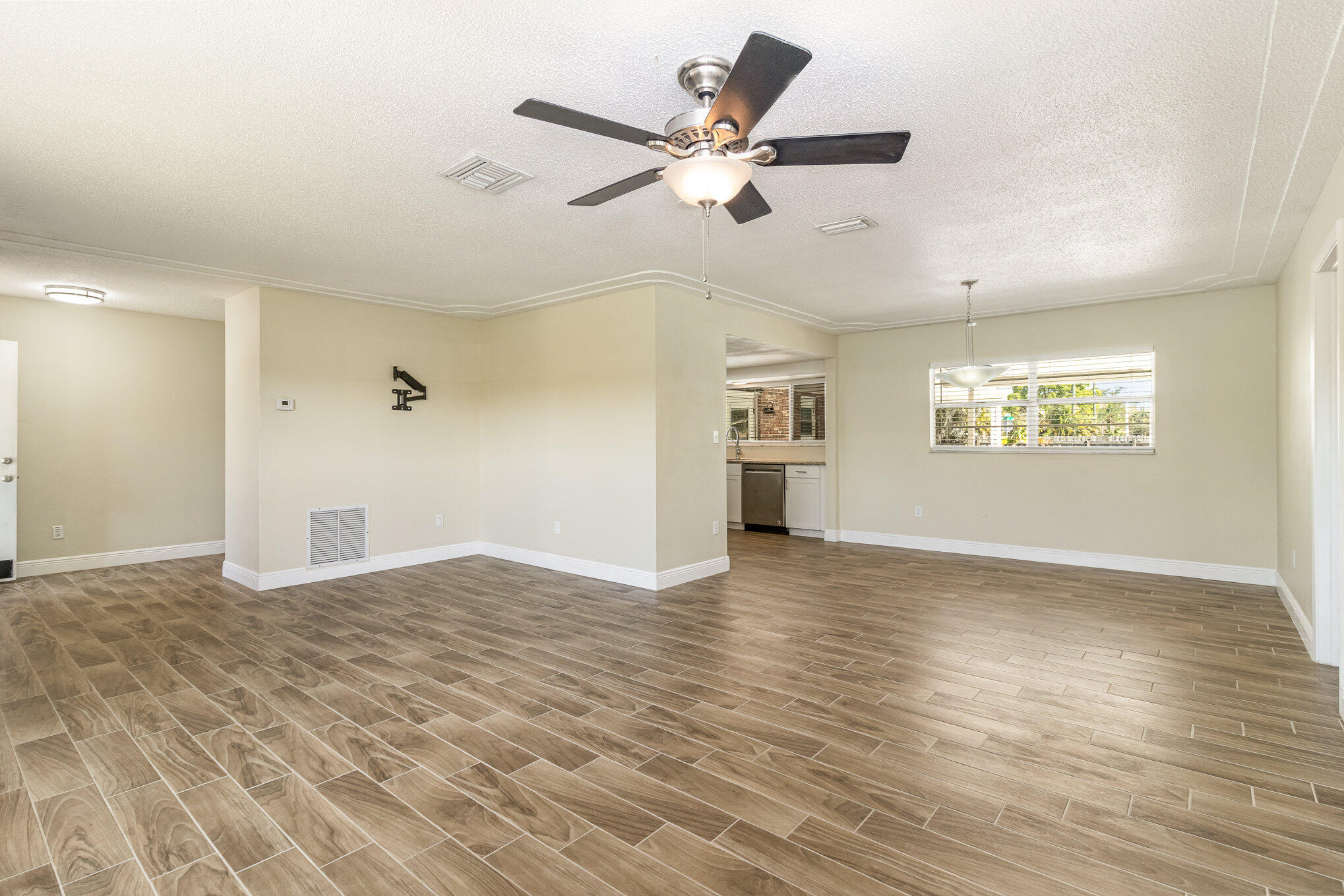 1294 Cimarron Circle Northeast Palm Bay, FL 32905 - Photo 8 of 45 a view of an empty room with a window