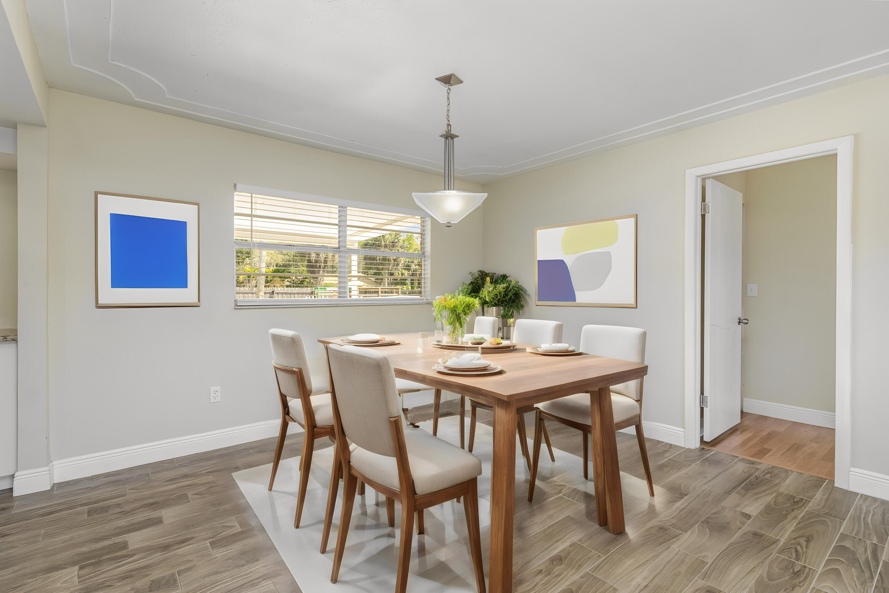 1294 Cimarron Circle Northeast Palm Bay, FL 32905 - Photo 10 of 45 a view of a dining room with furniture window and wooden floor