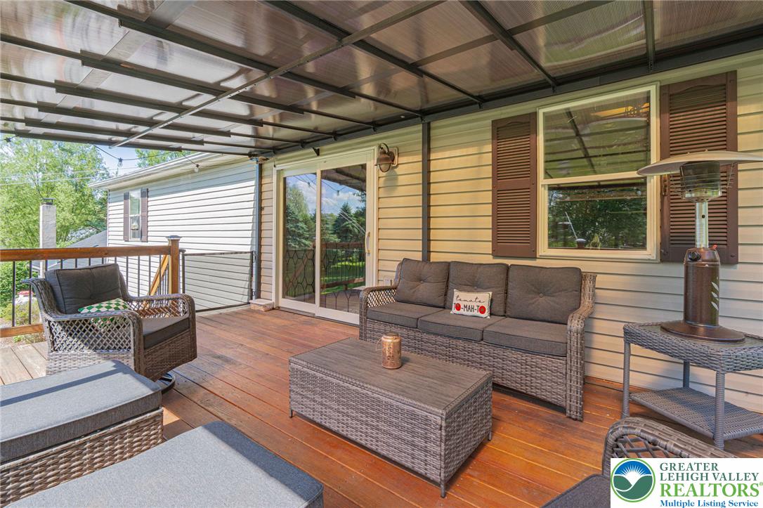 341 Lower Greenhill Road Kunkletown, PA 18058 - Photo 45 of 69 A spacious covered deck extends the living space outdoors, perfect for enjoying tranquil moments.