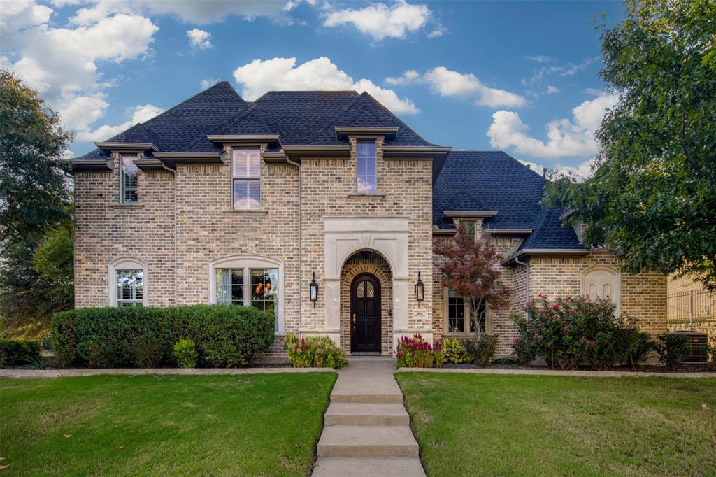 801 White Buffalo Lane Heath, TX 75032 - Photo 18 of 39 a front view of a house with garden