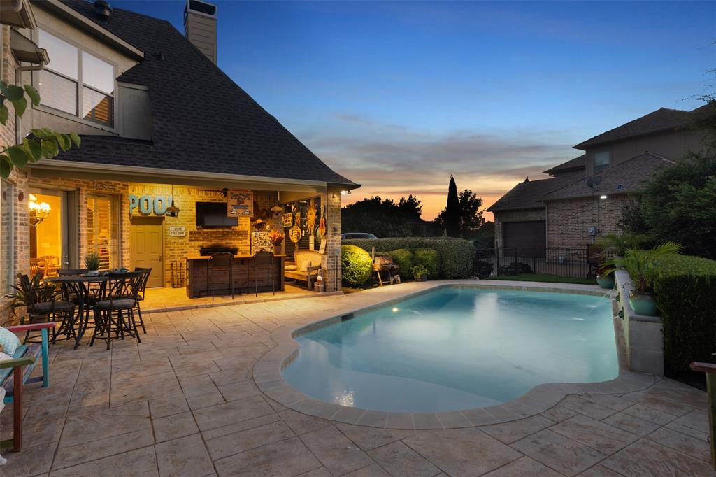 801 White Buffalo Lane Heath, TX 75032 - Photo 20 of 39 a view of a swimming pool with outdoor seating