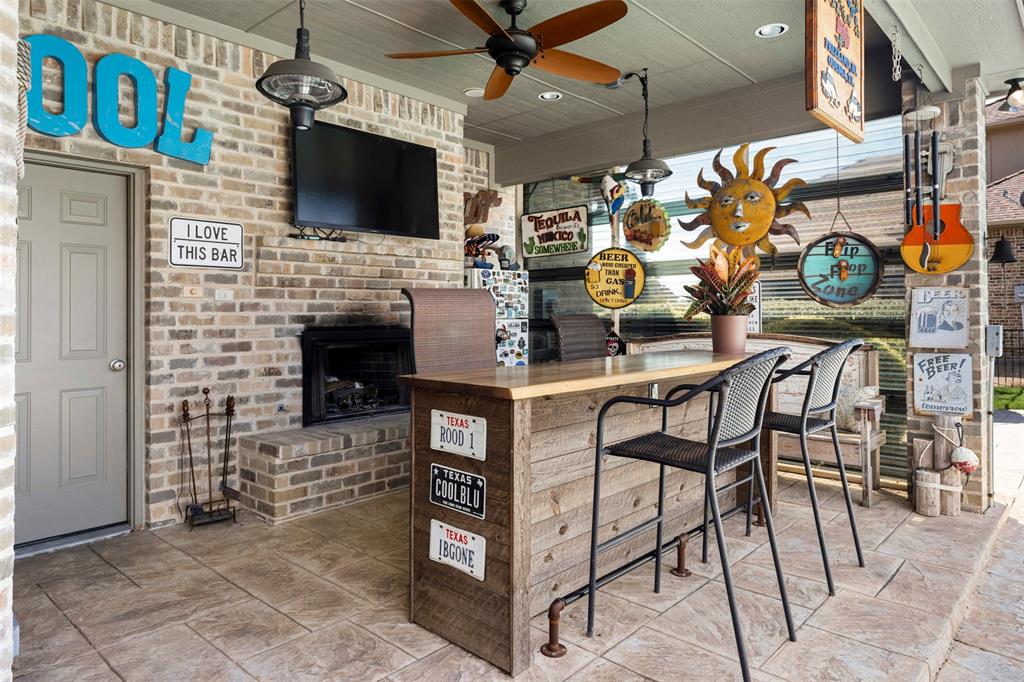 801 White Buffalo Lane Heath, TX 75032 - Photo 21 of 39 a view of a livingroom with furniture and a flat screen tv