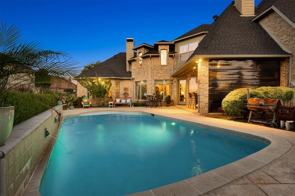 801 White Buffalo Lane Heath, TX 75032 - Photo 3 of 39 a view of a house with a swimming pool