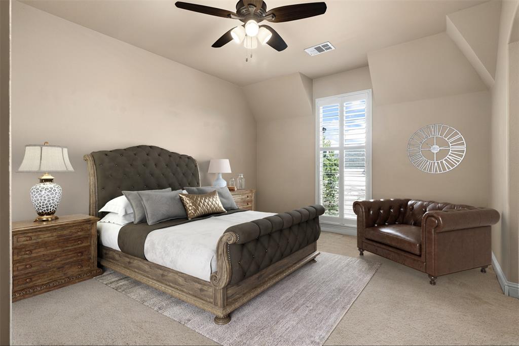 801 White Buffalo Lane Heath, TX 75032 - Photo 31 of 39 a bedroom with a bed couch and window