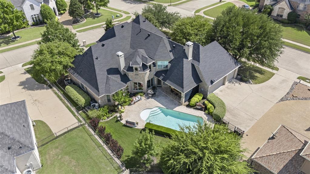 801 White Buffalo Lane Heath, TX 75032 - Photo 5 of 39 an aerial view of a house with garden space and street view