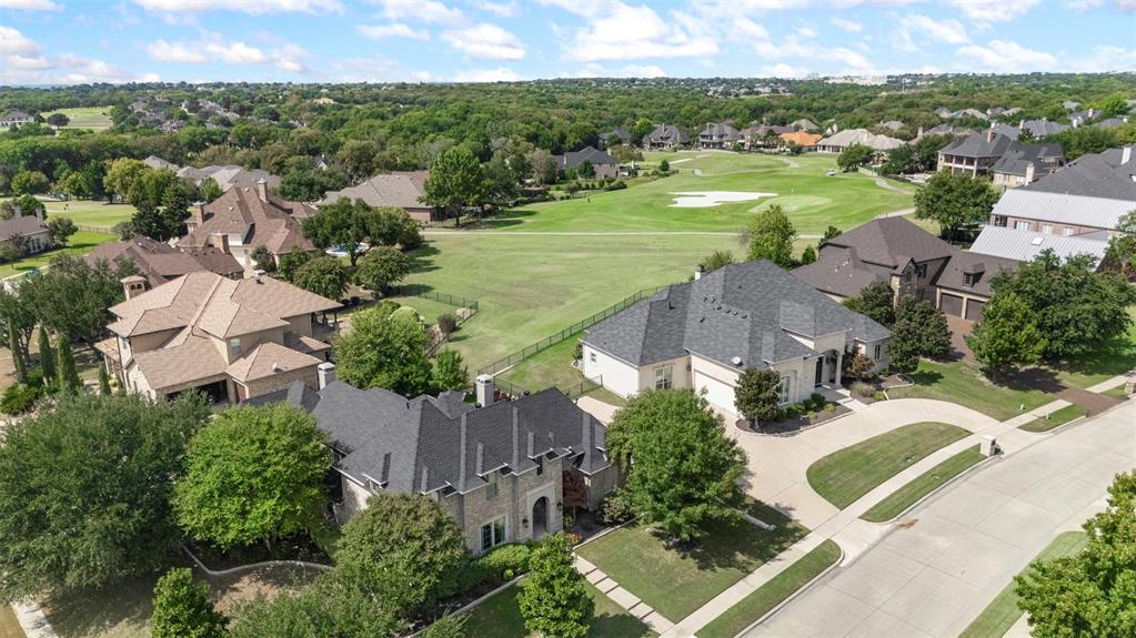 801 White Buffalo Lane Heath, TX 75032 - Photo 7 of 39 an aerial view of a house with garden space and street view