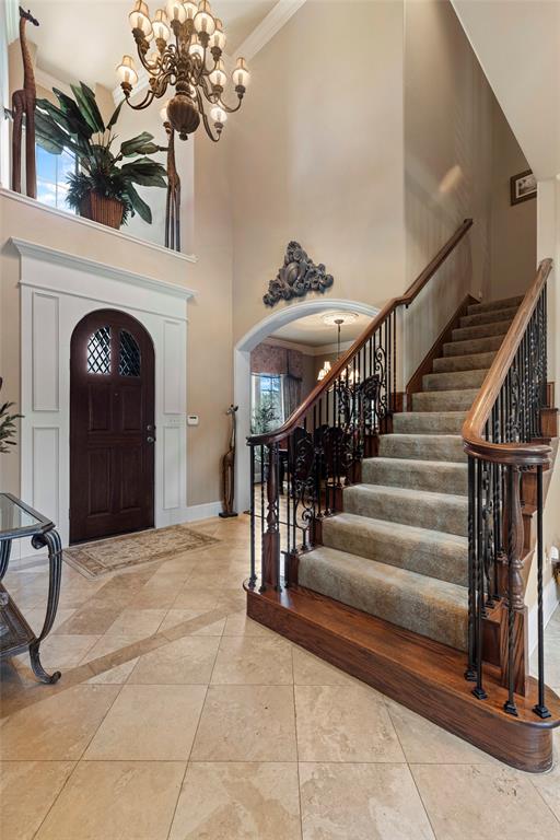 801 White Buffalo Lane Heath, TX 75032 - Photo 8 of 39 a view of entryway and hall with a chandelier