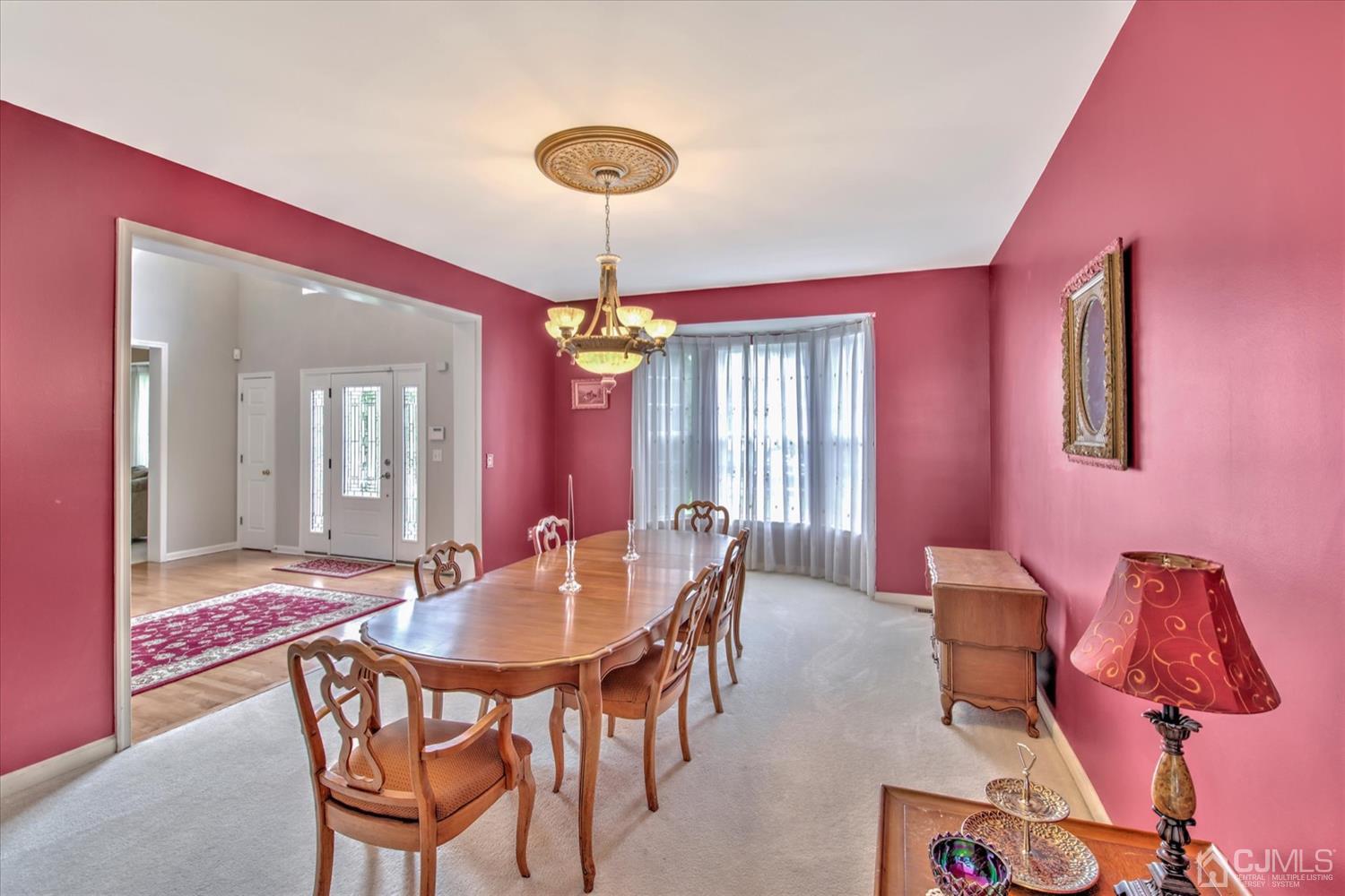 32 Spruce Meadows Drive Monroe Township, NJ 08831 - Photo 12 of 46 a view of a dining room with furniture and chandelier