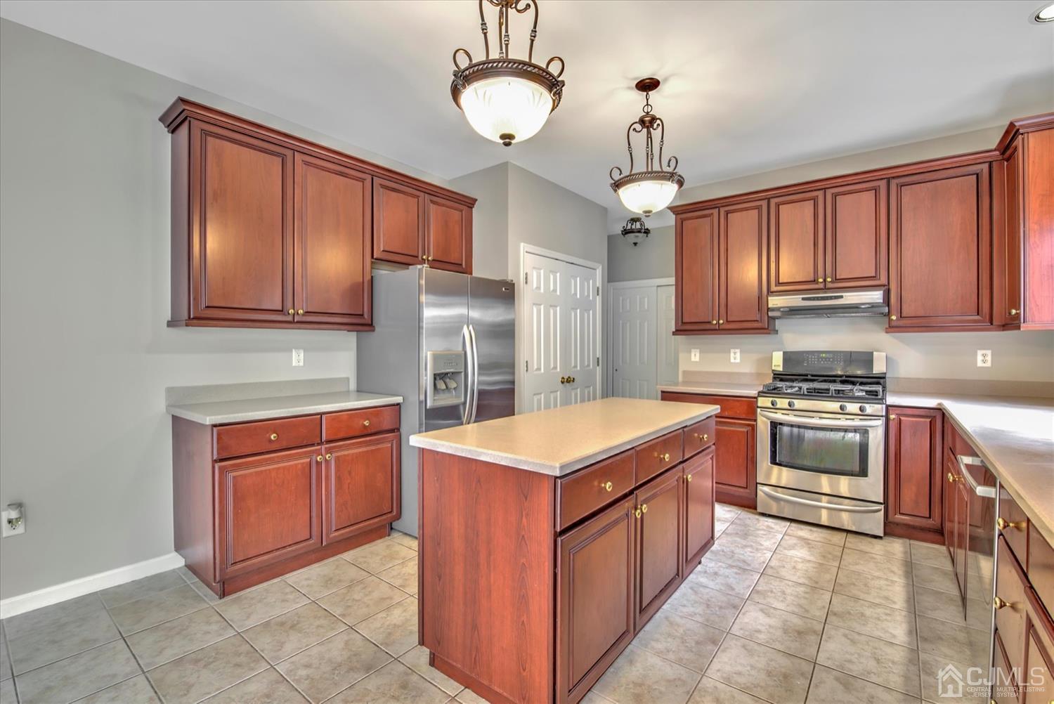 32 Spruce Meadows Drive Monroe Township, NJ 08831 - Photo 14 of 46 a kitchen with stainless steel appliances granite countertop a stove top oven a refrigerator a sink and dishwasher