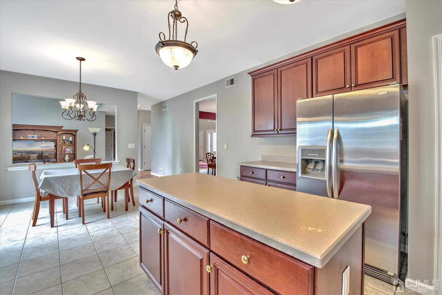 32 Spruce Meadows Drive Monroe Township, NJ 08831 - Photo 17 of 46 a kitchen with cabinets and stainless steel appliances
