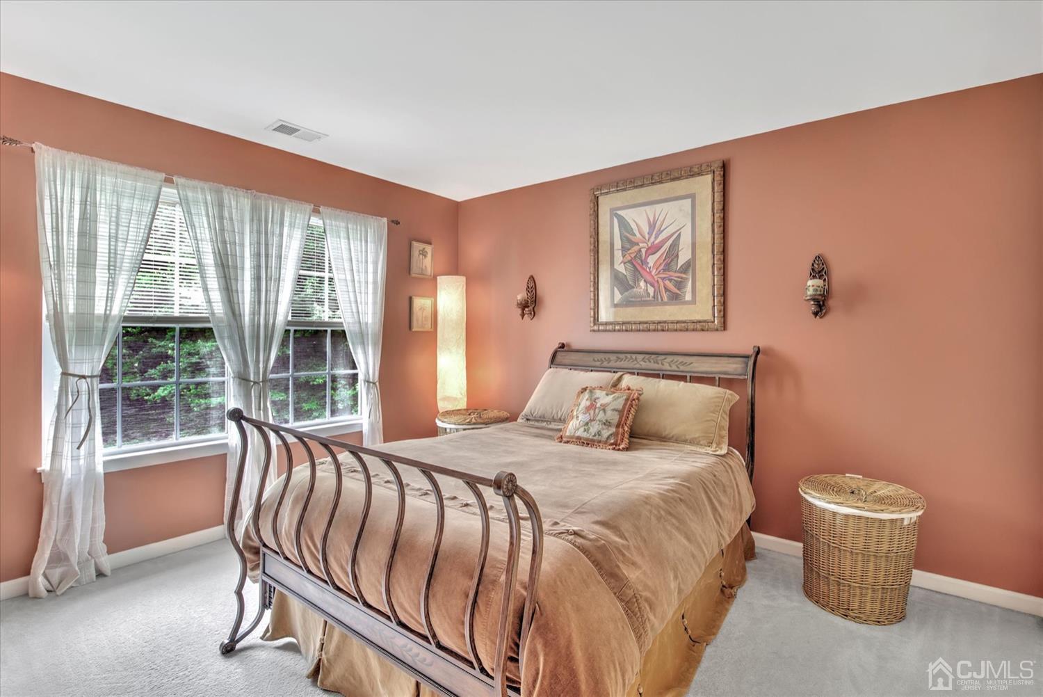 32 Spruce Meadows Drive Monroe Township, NJ 08831 - Photo 31 of 46 a bedroom with a large bed and a window