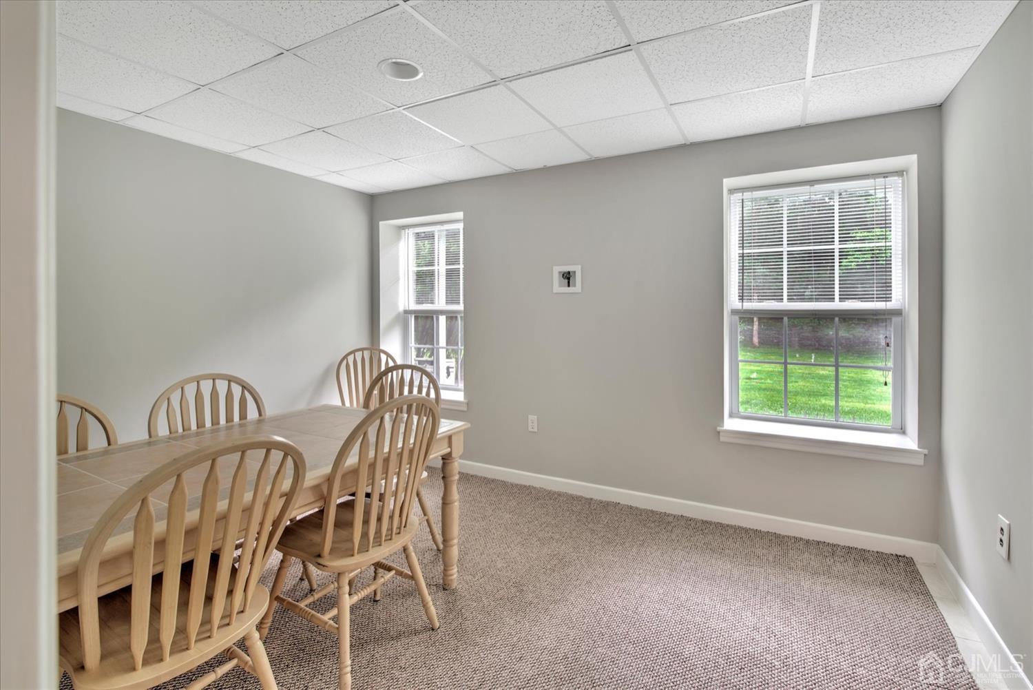 32 Spruce Meadows Drive Monroe Township, NJ 08831 - Photo 35 of 46 a view of a livingroom with furniture a ceiling fan and windows