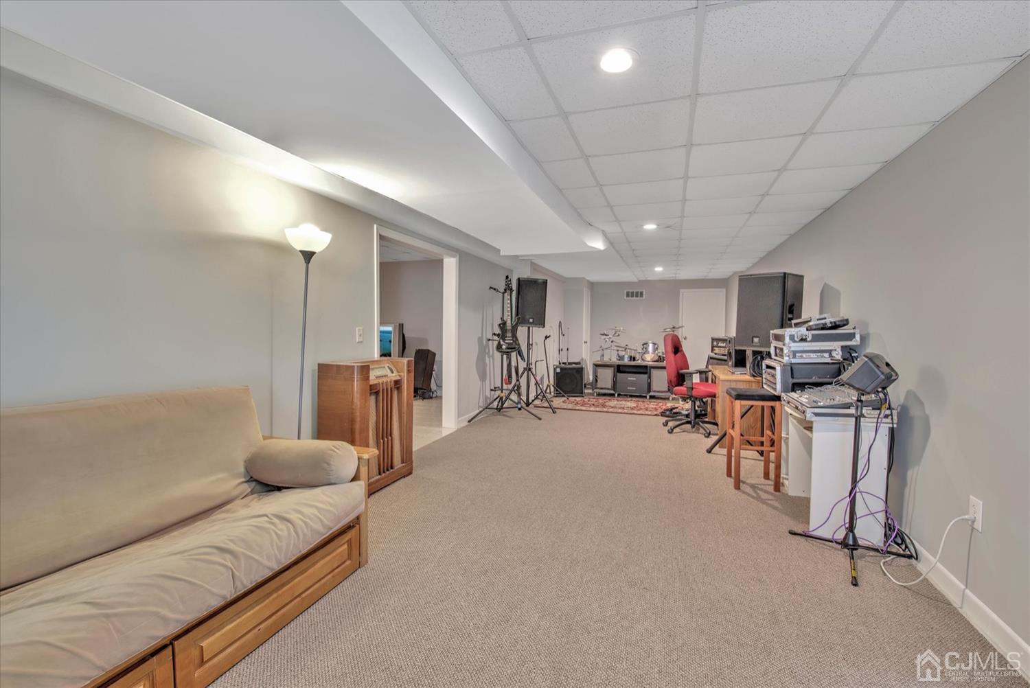 32 Spruce Meadows Drive Monroe Township, NJ 08831 - Photo 36 of 46 a living room with furniture and a large window