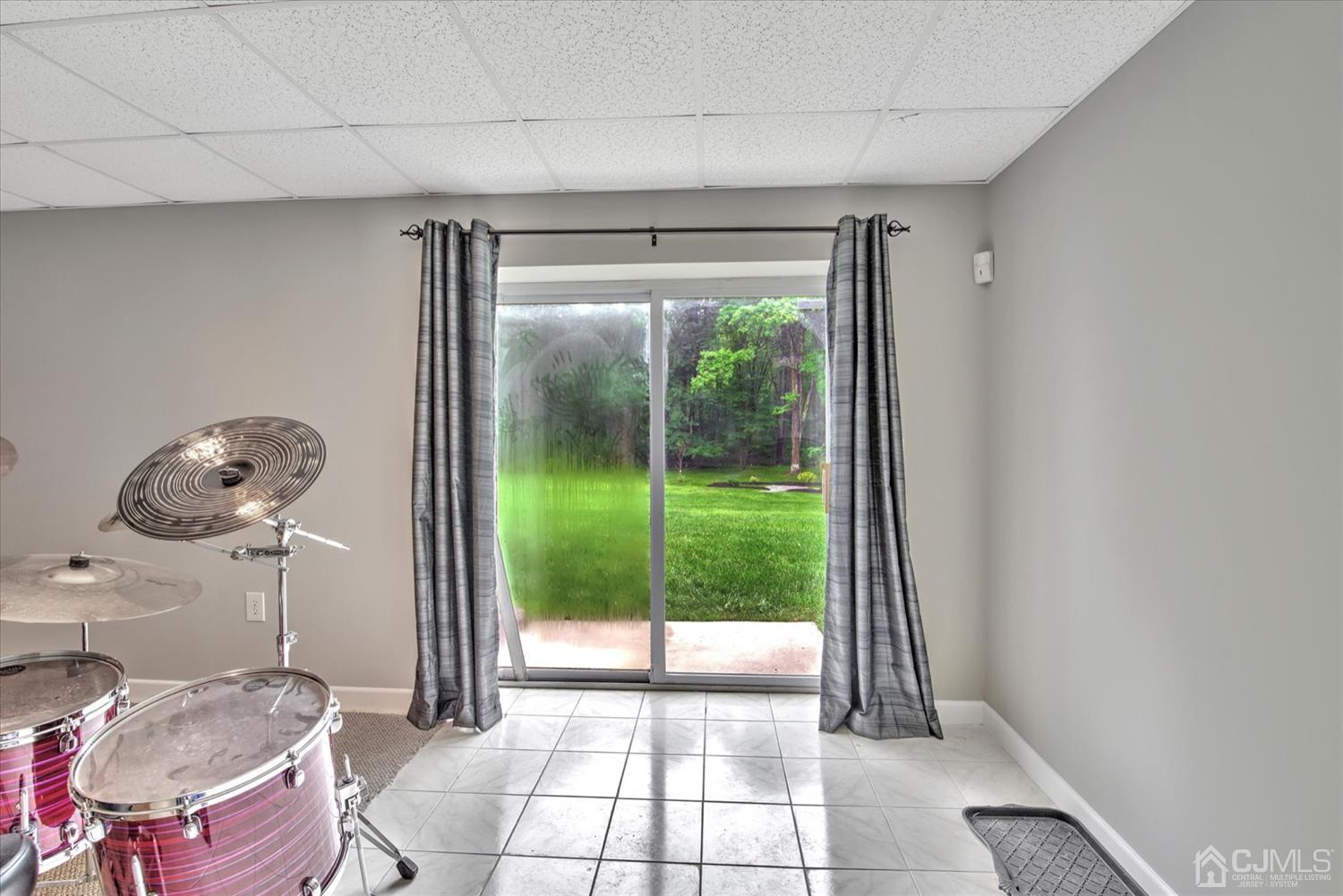 32 Spruce Meadows Drive Monroe Township, NJ 08831 - Photo 39 of 46 a living room with furniture and a floor to ceiling window
