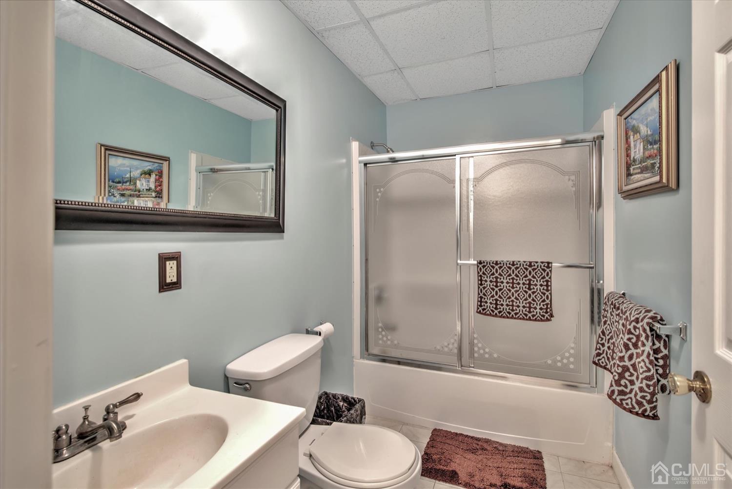 32 Spruce Meadows Drive Monroe Township, NJ 08831 - Photo 40 of 46 a bathroom with a toilet sink and mirror