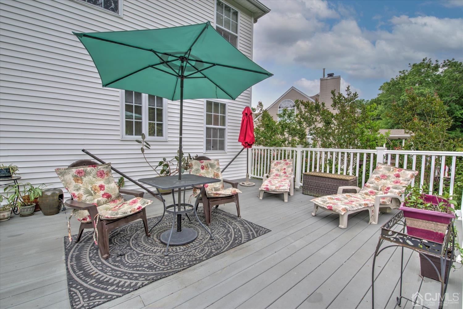 32 Spruce Meadows Drive Monroe Township, NJ 08831 - Photo 42 of 46 an outdoor space with furniture and umbrella