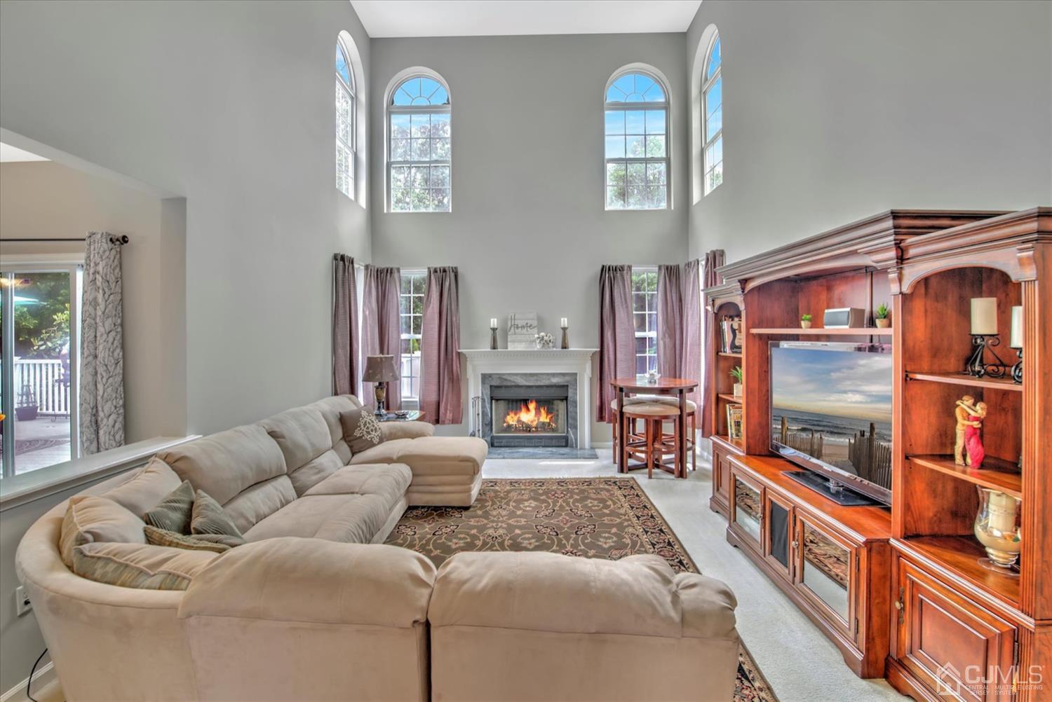 32 Spruce Meadows Drive Monroe Township, NJ 08831 - Photo 8 of 46 a living room with furniture fireplace and flat screen tv