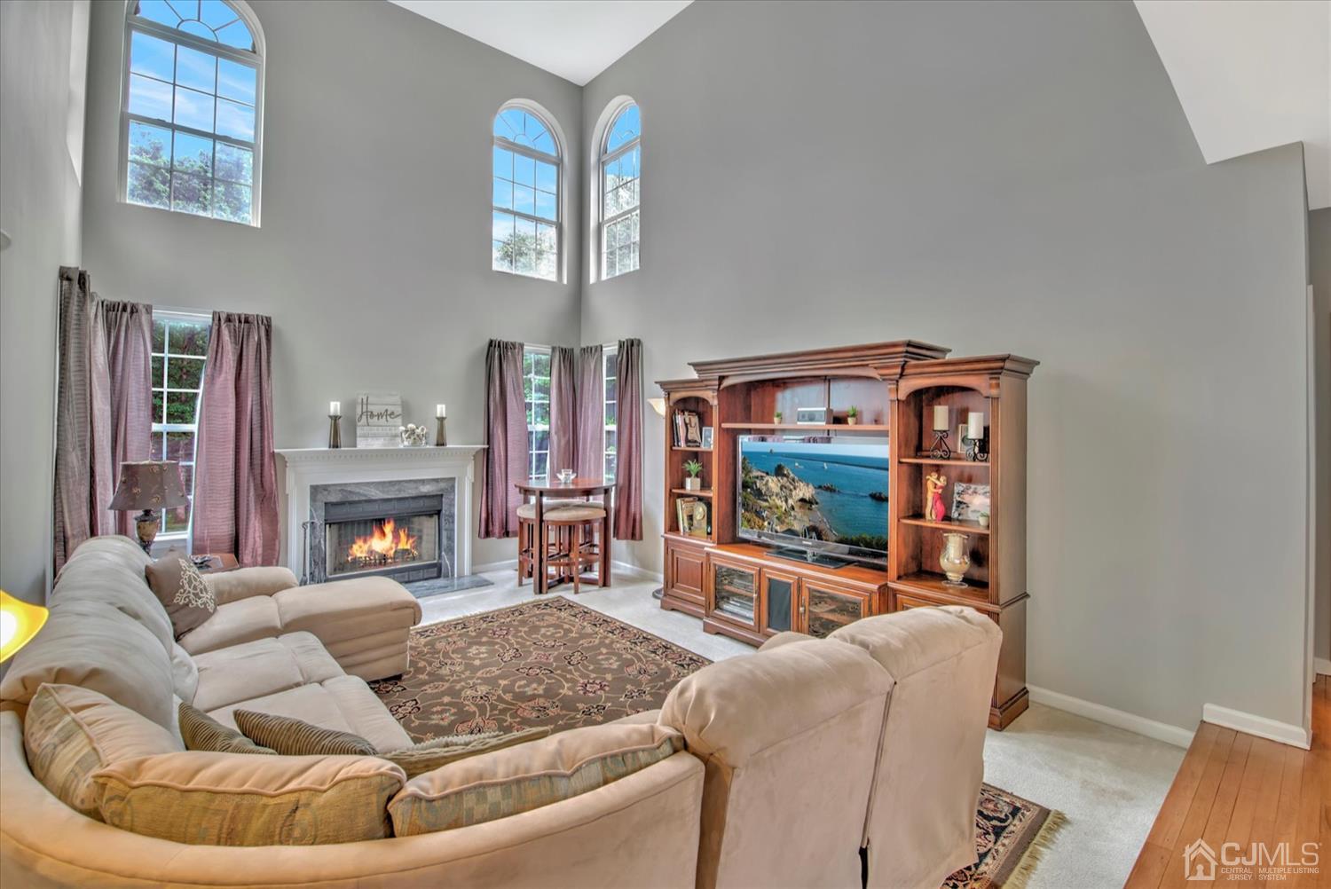 32 Spruce Meadows Drive Monroe Township, NJ 08831 - Photo 9 of 46 a living room with furniture and a fireplace