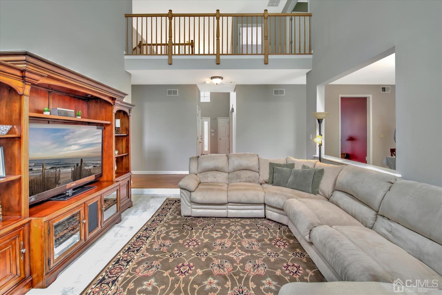 32 Spruce Meadows Drive Monroe Township, NJ 08831 - Photo 10 of 46 a living room with furniture and a flat screen tv