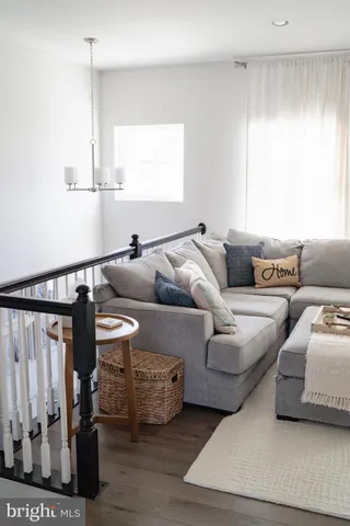 a kitchen with a table chairs sink and cabinets