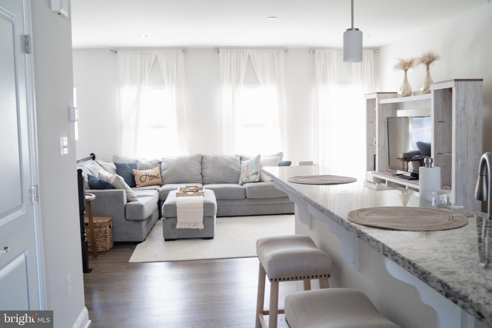 36046 Auburn Way Millsboro, DE 19966 - Photo 16 of 56 a living room with furniture and a granite counter tops