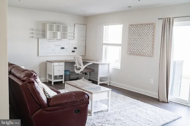 a bedroom with a bed and a lamp on table