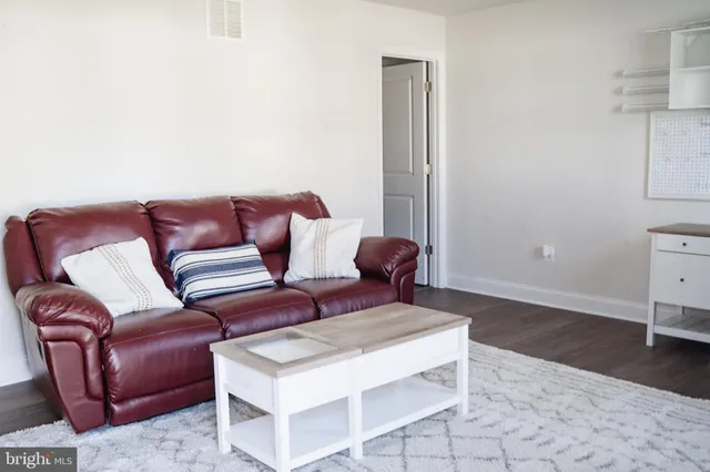 a bedroom with a bed and a table