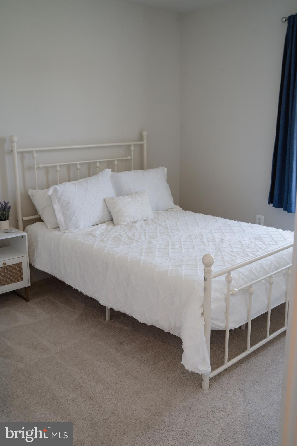 36046 Auburn Way Millsboro, DE 19966 - Photo 44 of 56 a bedroom with a bed and a table